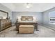 This main bedroom boasts a tray ceiling, carpeting and natural light from a nearby window at 373 Brianne Ln, Danville, IN 46122
