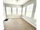 Bright sunroom filled with lots of windows providing tons of natural light and access to the deck at 373 Brianne Ln, Danville, IN 46122