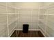 A spacious walk-in closet with organized shelving provides ample storage space and organization in the home at 373 Brianne Ln, Danville, IN 46122