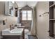 Clean bathroom with shower/tub combo, tile surround, and updated vanity at 3816 Rookwood Ave, Indianapolis, IN 46208