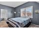 Gray bedroom with striped bedding and window with shutters at 3816 Rookwood Ave, Indianapolis, IN 46208