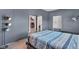 Gray bedroom with striped bedding, closet, and adjacent room at 3816 Rookwood Ave, Indianapolis, IN 46208