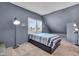 Blue and gray bedroom with striped bedding and floor lamp at 3816 Rookwood Ave, Indianapolis, IN 46208