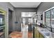 Open concept kitchen with green cabinets and a view into the laundry room at 3816 Rookwood Ave, Indianapolis, IN 46208