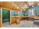Cozy attic office with wood walls, desk, and window seat at 3816 Rookwood Ave, Indianapolis, IN 46208