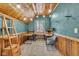Unique attic office with wood details and L-shaped desk at 3816 Rookwood Ave, Indianapolis, IN 46208