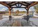 Relaxing patio features a pergola, seating and a view of the backyard at 4050 Woodshire Pl, Clayton, IN 46118