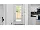 White back door with glass panel offering view of backyard at 459 N Concord St, Indianapolis, IN 46222