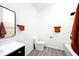 Bathroom with bathtub, toilet and modern vanity at 459 N Concord St, Indianapolis, IN 46222