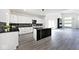 Modern kitchen with a large island, granite countertops, and an open floor plan at 459 N Concord St, Indianapolis, IN 46222