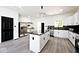 Modern kitchen with white cabinets, granite countertops, and stainless steel appliances at 459 N Concord St, Indianapolis, IN 46222
