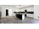 Modern kitchen with white shaker cabinets, granite countertops, and a large island at 459 N Concord St, Indianapolis, IN 46222
