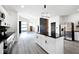 Open concept kitchen with island, granite countertops, and stainless steel appliances at 459 N Concord St, Indianapolis, IN 46222