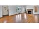 Living room with hardwood floors, fireplace, and large windows at 5710 N Delaware St, Indianapolis, IN 46220