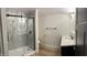 Modern bathroom with a walk-in shower, marble tile, and floating vanity at 633 S 17Th St, Elwood, IN 46036
