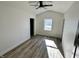 Bright bedroom with new flooring and ceiling fan at 633 S 17Th St, Elwood, IN 46036