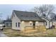 Beige house with new deck and landscaping at 633 S 17Th St, Elwood, IN 46036