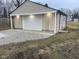 Detached garage with white door and light gray siding at 633 S 17Th St, Elwood, IN 46036