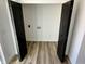 Laundry room with dark wood doors and vinyl flooring at 633 S 17Th St, Elwood, IN 46036
