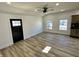 Bright living room with new flooring and ceiling fan at 633 S 17Th St, Elwood, IN 46036
