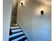 Modern staircase with dark wood steps and white risers at 633 S 17Th St, Elwood, IN 46036