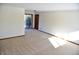 Spacious carpeted basement room with sliding glass door at 6628 E Michigan St, Indianapolis, IN 46219