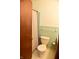 Small bathroom with shower stall, toilet and light green tile at 6628 E Michigan St, Indianapolis, IN 46219