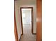 Bedroom with carpet, door to another room and window at 6628 E Michigan St, Indianapolis, IN 46219