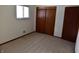 Simple bedroom with carpeted floor and large closet at 6628 E Michigan St, Indianapolis, IN 46219