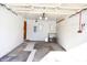Attached garage with overhead door and workbench at 6628 E Michigan St, Indianapolis, IN 46219