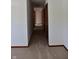 Carpeted hallway with access to bedrooms and closets at 6628 E Michigan St, Indianapolis, IN 46219