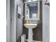 Small bathroom with pedestal sink and gray walls at 714 Keepsake Run, Greenwood, IN 46143