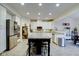 Modern kitchen with white cabinets, granite countertops, and island at 714 Keepsake Run, Greenwood, IN 46143