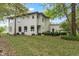 Landscaped backyard with patio and deck, offering outdoor living space at 7812 Preservation Dr, Indianapolis, IN 46278
