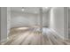 Finished basement room with light wood flooring and recessed lighting at 7812 Preservation Dr, Indianapolis, IN 46278
