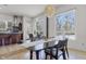 Spacious dining area with black table and chairs, near kitchen at 7812 Preservation Dr, Indianapolis, IN 46278