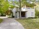Modern two-story house with stone accents, covered porch and landscaped yard at 7812 Preservation Dr, Indianapolis, IN 46278