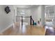 Bright hallway with hardwood floors and modern artwork at 7812 Preservation Dr, Indianapolis, IN 46278