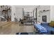 Bright living room features hardwood floors, a fireplace, and ample natural light at 7812 Preservation Dr, Indianapolis, IN 46278