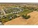 A community with a central pond is surrounded by homes, fields and mature trees at 8552 E 550 S, Zionsville, IN 46077