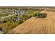 Aerial shot featuring the home, mature trees, surrounding farmland, and neighboring homes at 8552 E 550 S, Zionsville, IN 46077