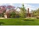 Expansive backyard with lush green lawn, patio area and mature trees at 8552 E 550 S, Zionsville, IN 46077