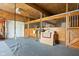 Inside horse barn featuring wooden stalls with metal bars, enhancing the equestrian ambiance and utility at 8552 E 550 S, Zionsville, IN 46077