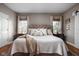 Comfortable bedroom featuring a large bed with a tufted headboard, bedside tables, and natural light at 8552 E 550 S, Zionsville, IN 46077