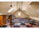 Bonus room featuring a checkerboard floor, skylight, and a stylish area rug at 8552 E 550 S, Zionsville, IN 46077