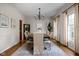 Elegant dining room with stylish chandelier, large rug, and neutral decor for formal entertaining at 8552 E 550 S, Zionsville, IN 46077