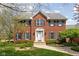 Charming brick two-story home with a well-manicured front yard and classic architectural details at 8552 E 550 S, Zionsville, IN 46077