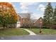 Beautifully landscaped brick home with mature trees, a curved walkway, and lovely curb appeal at 8552 E 550 S, Zionsville, IN 46077