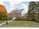 Well-maintained two-story brick home with mature trees and manicured landscaping at 8552 E 550 S, Zionsville, IN 46077