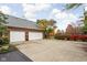 Spacious two-car garage with an expansive driveway surrounded by trees at 8552 E 550 S, Zionsville, IN 46077